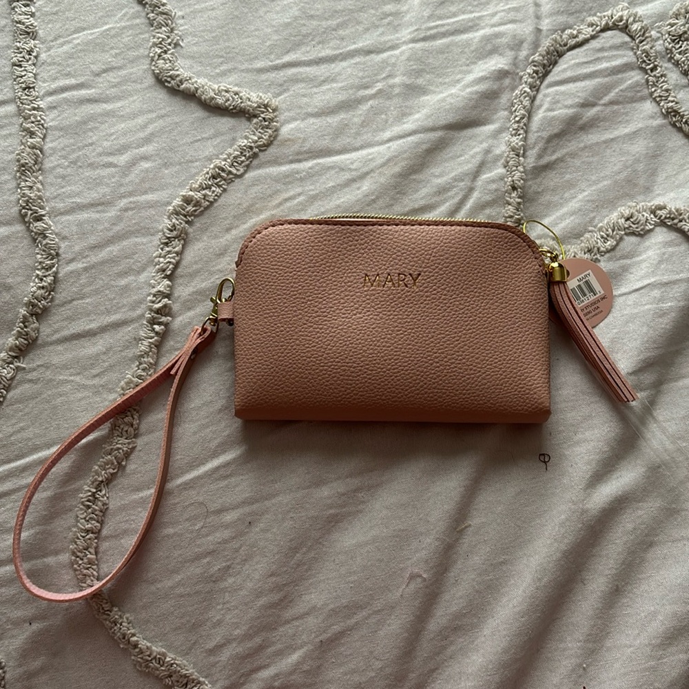 NWT Blush pink zipper wristlet with tassel. Personalized “Mary” in gold hardware